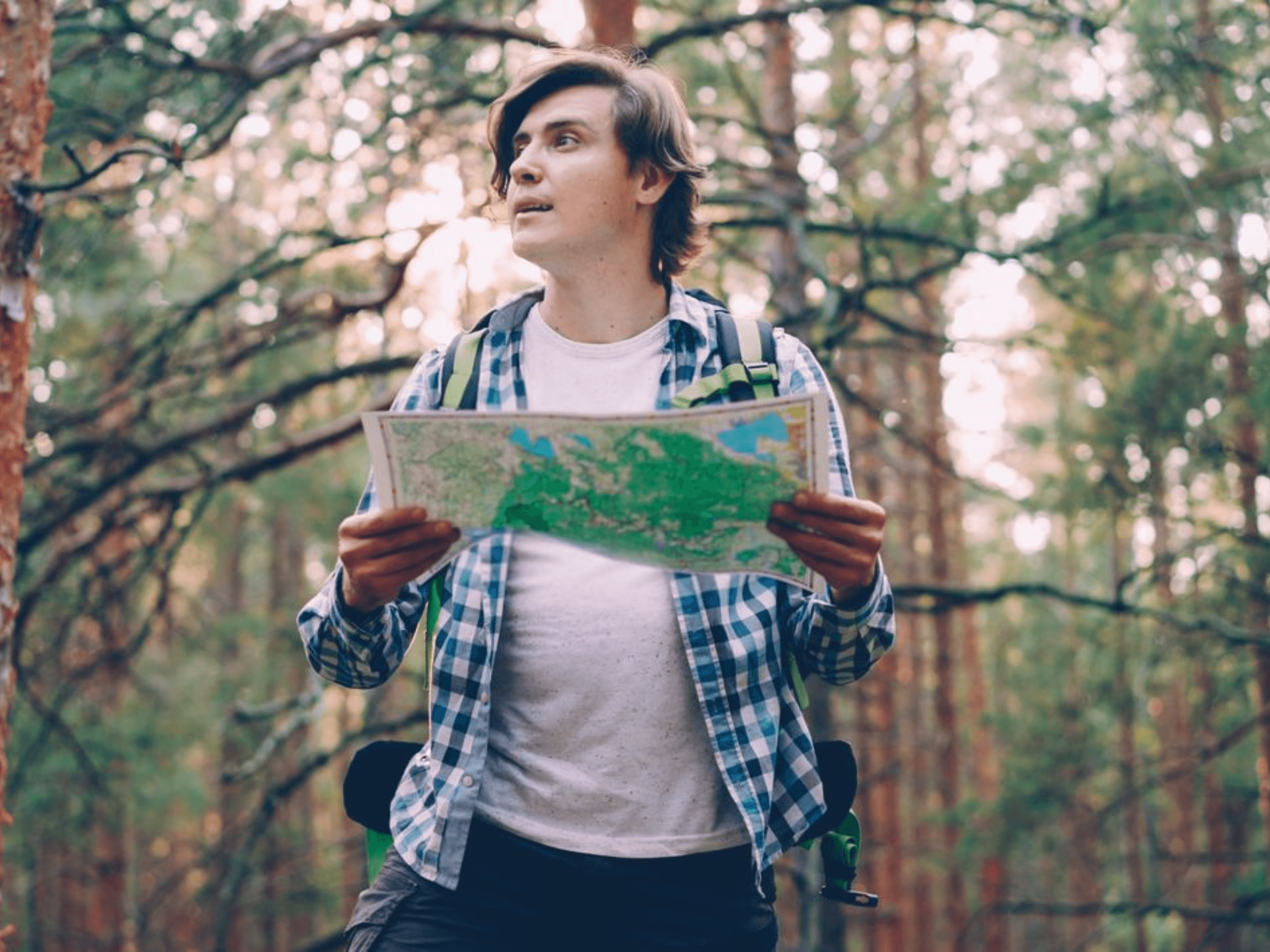 Map, cup of tea, and notebook traveler planning